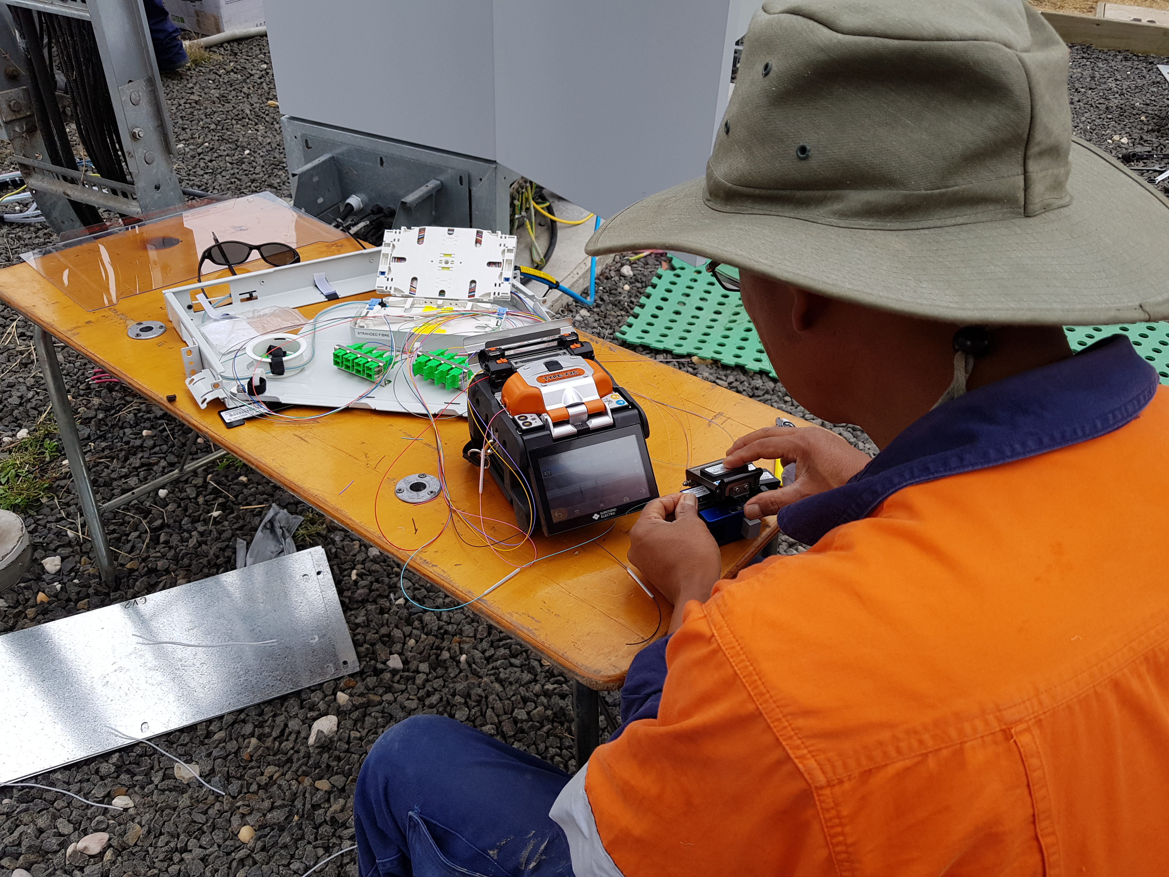 Nexgen technicians completing fibre work at a bench